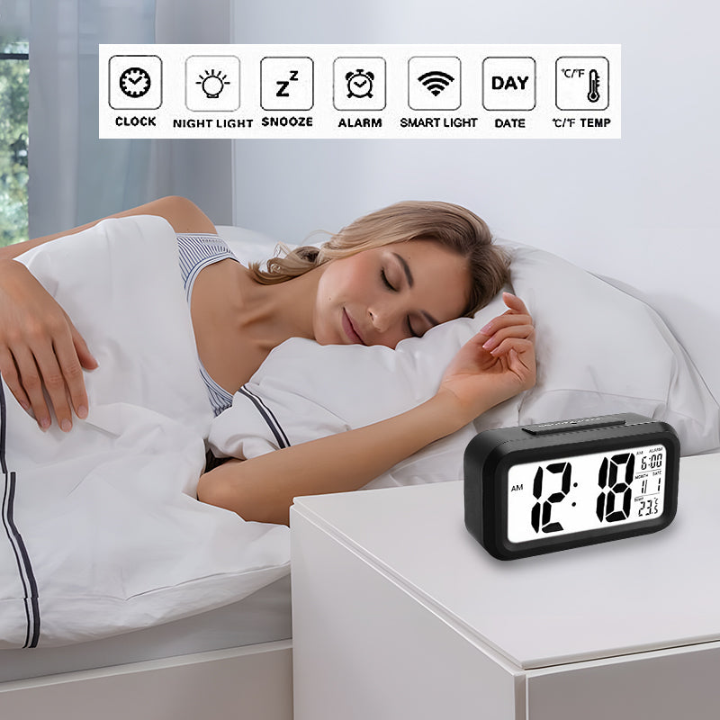 Digital alarm clock on a bedside table